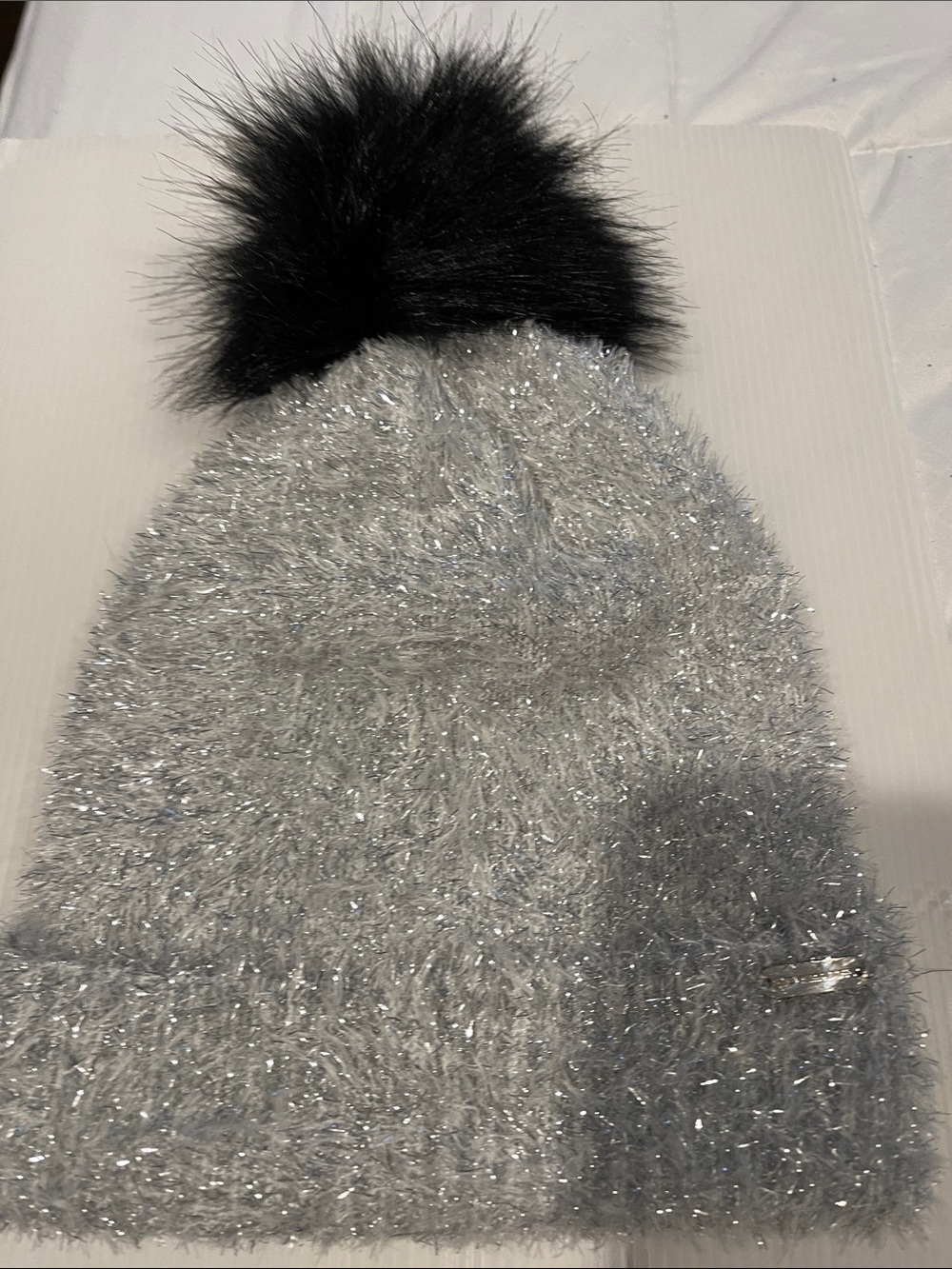Steve Madden Silver Sparkle Knit Beanie with Black Pom